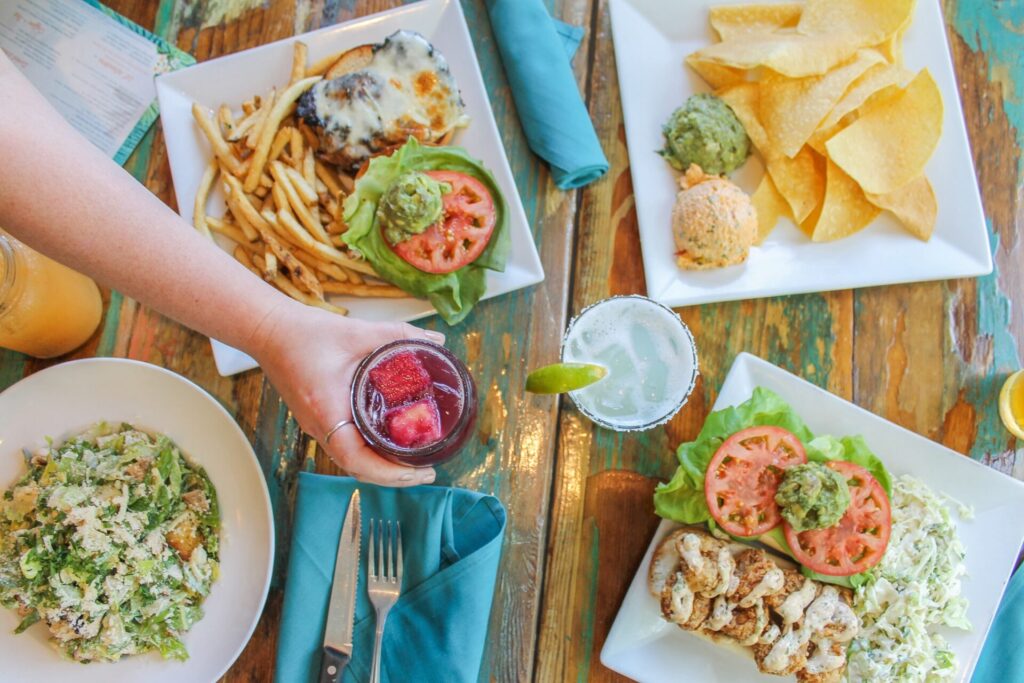 RUMBA table spread. Hand holding Sangria