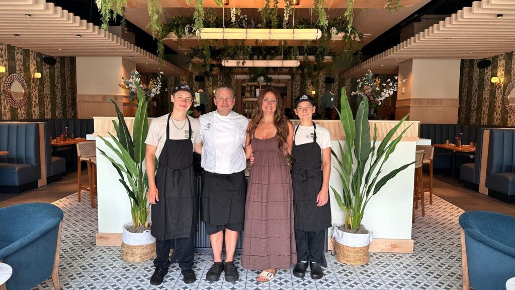 Rooted Hospitality Group co-founders David and Rachel Hersh with their sons Jude and Shayd inside the dining room at flora Charlotte in South End